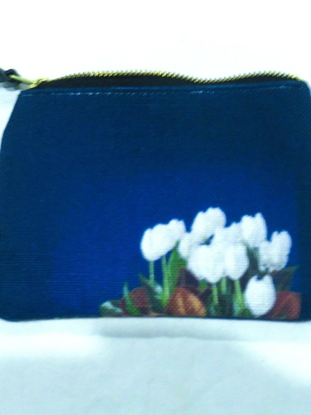 Society 6 blue cosmetic bag, white lilies, 6-1/2